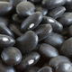 Pile of black beans in ceramic bowl